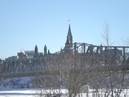 <a href="http://en.wikipedia.org/wiki/Parliament_Hill#Parliament_buildings">Parliament buildings</a>, from across the river