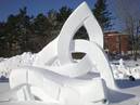 In a "milling frolic," people pound a loop of woven wool with their hands, in time to Gaelic songs.  The loop in our sculpture suggests the circular pounding motion and rhythm.  The Celtic knot (triquetra) stands for tradition and oral storytelling.  The hands represent the passing of history to future generations.